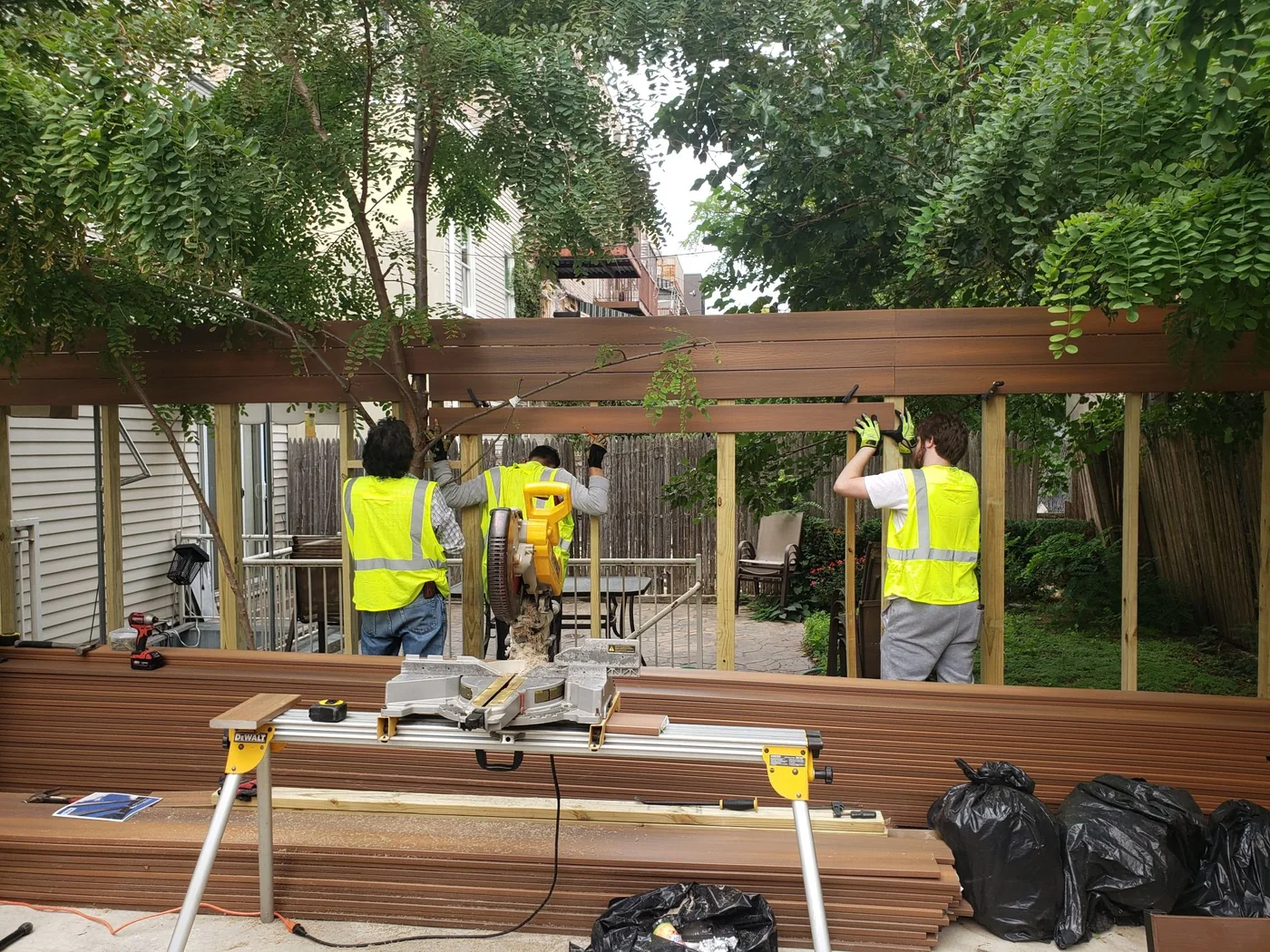 City Decks team working together on an outdoor wood structure