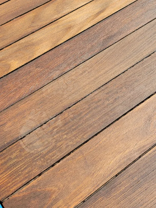 IPE hardwood decking boards showing natural grain and variations in warm brown tones