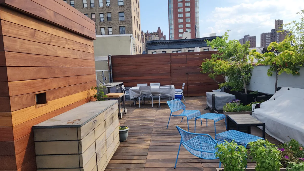 Rooftop planting areas and custom planter finishes coordinated with the outdoor layout